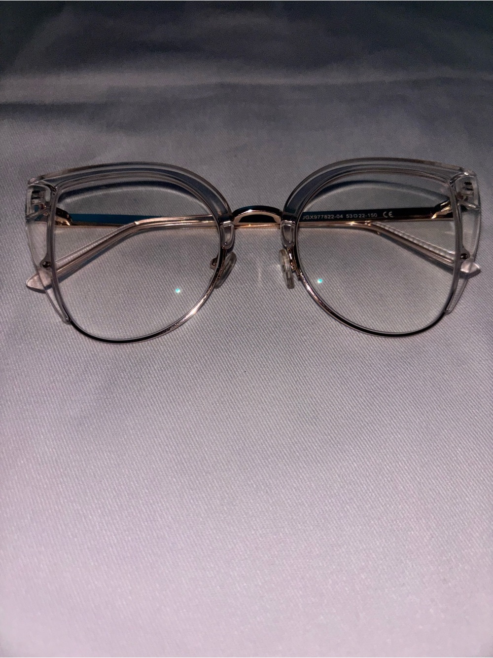 Transparent Round Women's Eyeglasses with Subtle Metal Accents